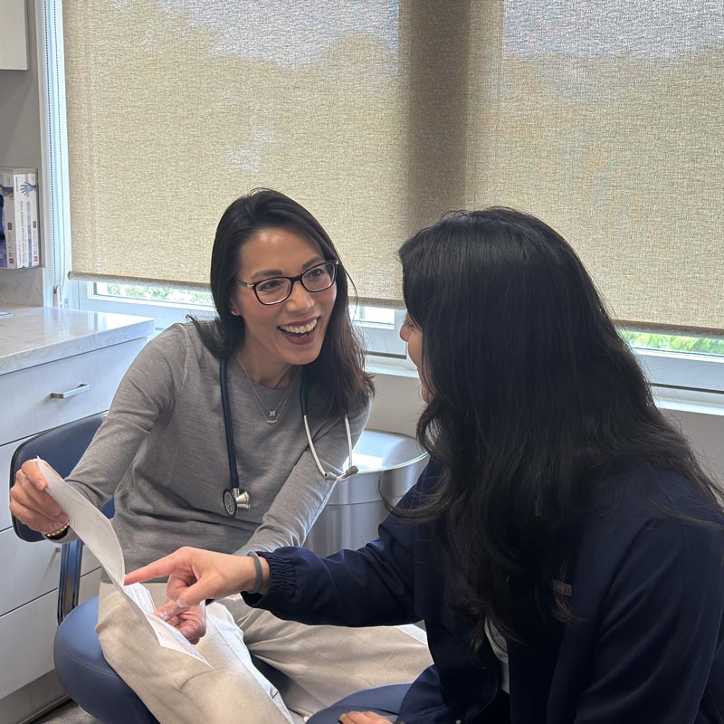 Dr. Jane Yu reviewing test results with patient
