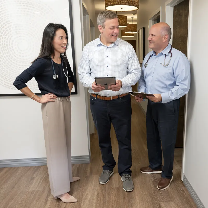 Doctors Jane, Fred and Jon consulting with eachother